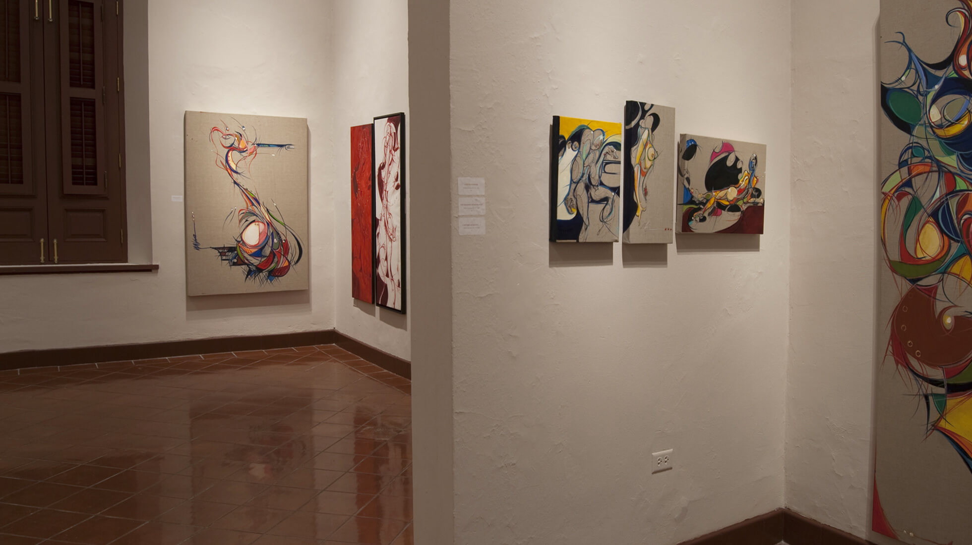 Photo of the Salon C of artist and painter Michael J. Korber at his Art Retrospective at the Museo de las Américas in Old San Juan, Puerto Rico, titled - A decade of line and color, in 2007.