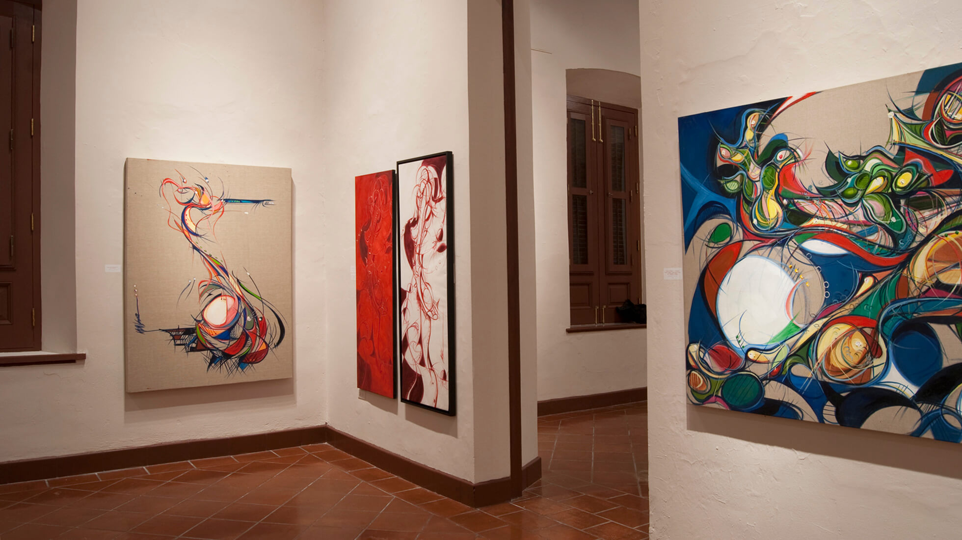 Photo of the Salon D of artist and painter Michael J. Korber at his Art Retrospective at the Museo de las Américas in Old San Juan, Puerto Rico, titled - A decade of line and color, in 2007.