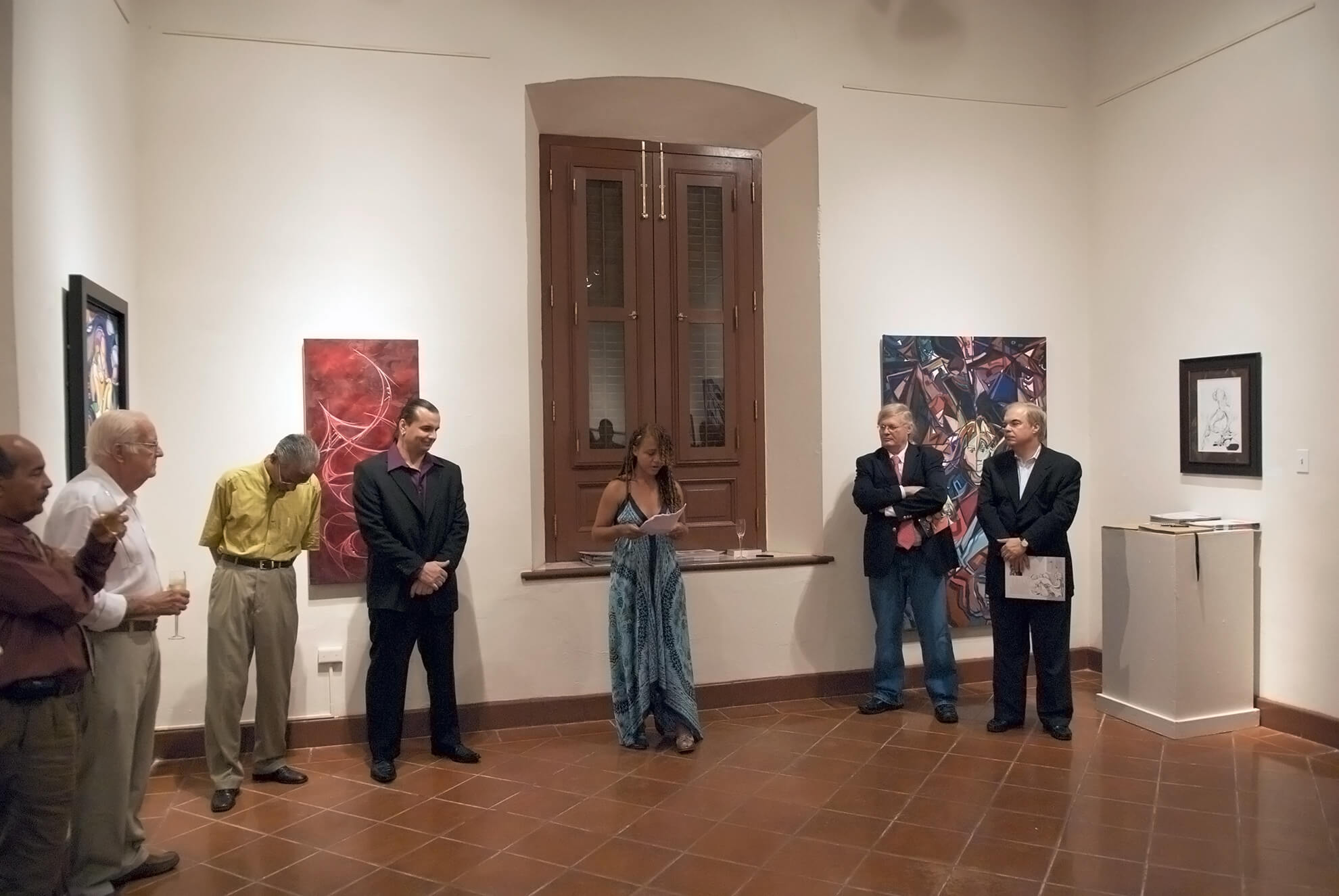 Poet Lady Lee Andrews reciting her A Poem to an Artist, at the opening reception of Korber's Retrospect Exhibit A decade of line and color in Museo de las Américas - San Juan, Puerto Rico.
