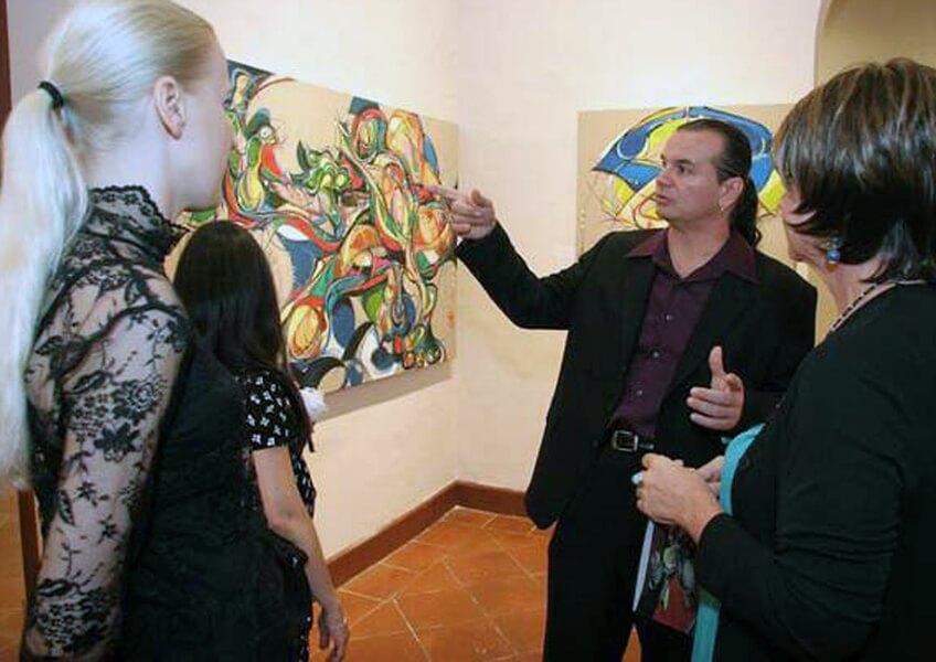 Photo of  Guests at Ballajá Barracks at Museo de las Américas in Old San Juan, Puerto Rico at the artist and painter Michael J. Korber's Art Retrospective Exhibit reception, titled A decade of line and color, in 2007.