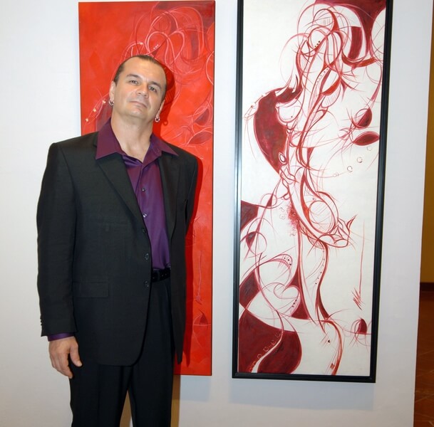 Photo of Michael J. Korber the artist at Ballajá Barracks at Museo de las Américas in Old San Juan, Puerto Rico at his Art Retrospective Exhibit, titled - A decade of line and color, in 2007.